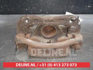Used Front brake calliper, left Kia Carens III (FG) 2.0i CVVT 16V Price on request offered by V.Deijne Jap.Auto-onderdelen BV
