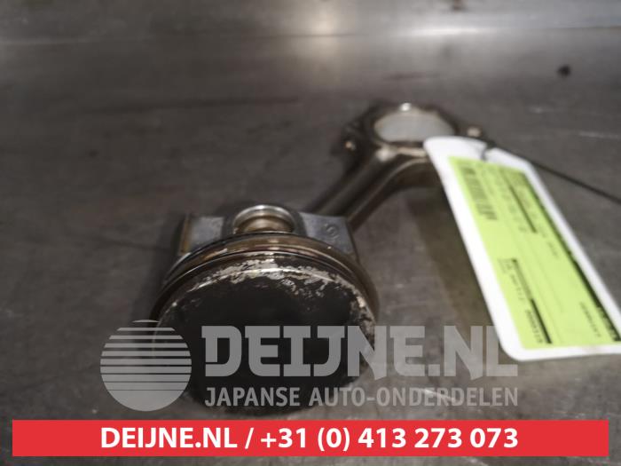 Piston from a Nissan Pulsar (C13) 1.2 DIG-T 16V 2016