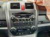 Radio d'un Honda CR-V (RE), 2006 2.2 i-CTDi 16V, SUV, Diesel, 2.204cc, 103kW (140pk), 4x4, N22A2; EURO4, 2007-01 / 2009-12, RE67 2009