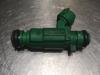 Injector (petrol injection) from a Hyundai Accent 1.4i 16V 2010