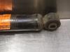 Rear shock absorber, left from a Kia Carnival 1 (FLB) 2.9 TD 16V 2001