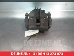 Used Front brake calliper, left Mitsubishi Carisma 1.8 GDI 16V Price € 30,00 Margin scheme offered by V.Deijne Jap.Auto-onderdelen BV