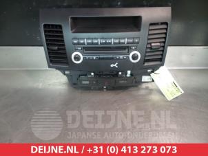 Used Radio control panel Mitsubishi Lancer Sports Sedan (CY/CZ) 1.5 MIVEC 16V Price € 75,00 Margin scheme offered by V.Deijne Jap.Auto-onderdelen BV
