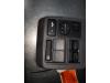Interruptor de ventanilla eléctrica de un Daihatsu Cuore (L251/271/276), 2003 1.0 12V DVVT, Hatchback, Gasolina, 989cc, 43kW (58pk), FWD, EJVE, 2003-05 / 2008-01, L251 2004