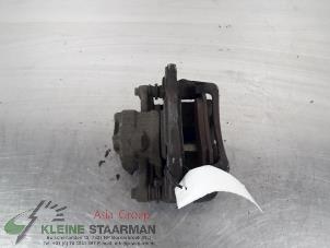 Used Front brake calliper, left Mitsubishi Colt (Z2/Z3) 1.5 16V CZ3 Price on request offered by Kleine Staarman B.V. Autodemontage