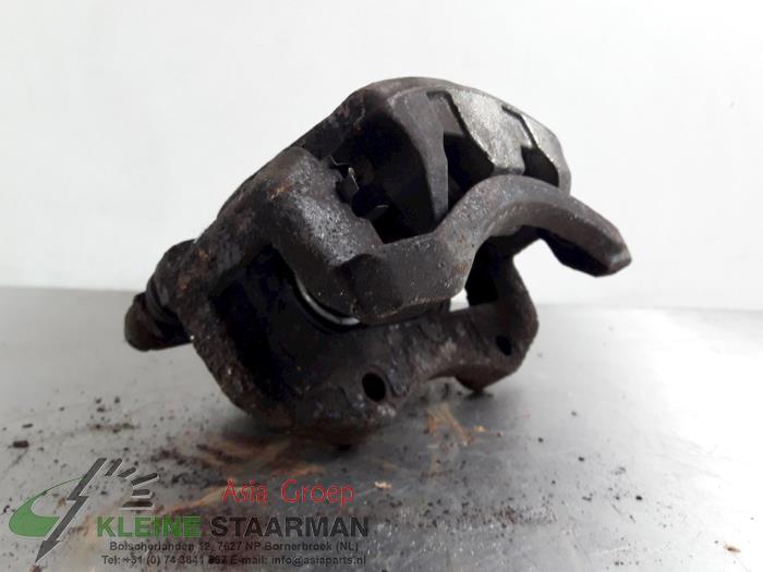 Front brake calliper, left from a Nissan X-Trail (T30) 2.5 16V 4x4 2007