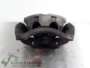 Used Front brake calliper, left Nissan X-Trail (T30) 2.5 16V 4x4 Price on request offered by Kleine Staarman B.V. Autodemontage