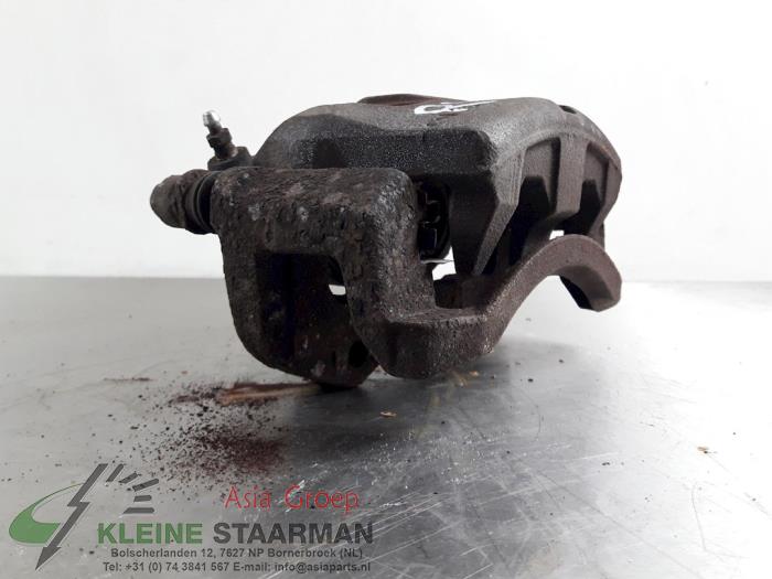 Front brake calliper, right from a Nissan X-Trail (T30) 2.5 16V 4x4 2007