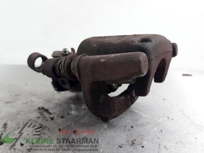 Rear brake calliper, left from a Mitsubishi Colt CZC 1.5 16V 2006