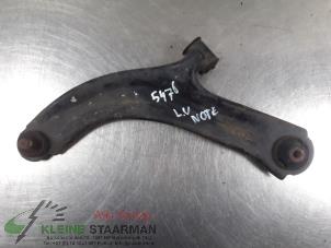 Used Front wishbone, left Nissan Note (E11) 1.4 16V Price on request offered by Kleine Staarman B.V. Autodemontage