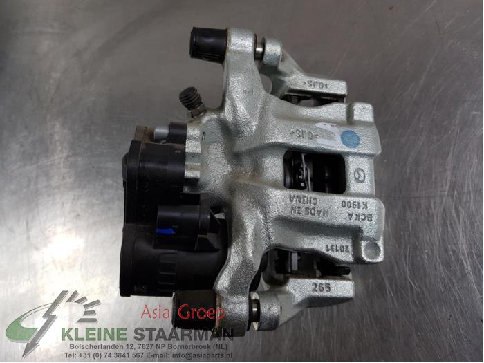 Rear brake calliper, left from a Mazda 3 Sport (BP) 2.0 SkyActiv-G 122 Mild Hybrid 16V 2019