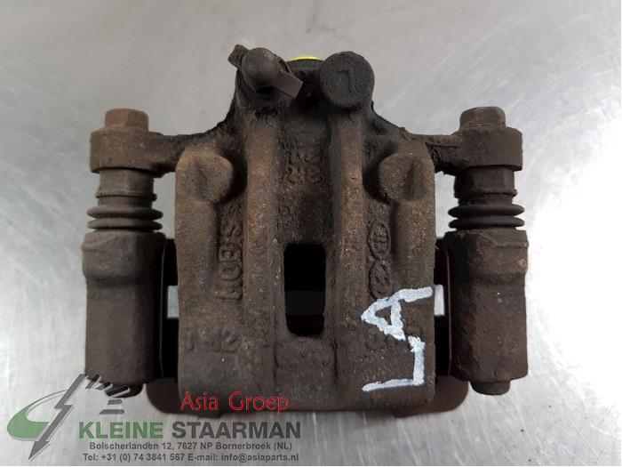 Rear brake calliper, left from a Kia Sportage (SL) 2.0 CVVT 16V 4x4 2011