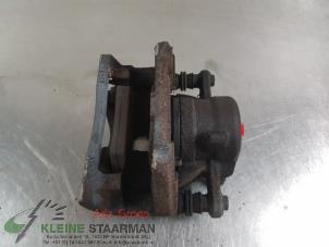 Used Front brake calliper, right Nissan Micra (K14) 0.9 IG-T 12V Price on request offered by Kleine Staarman B.V. Autodemontage
