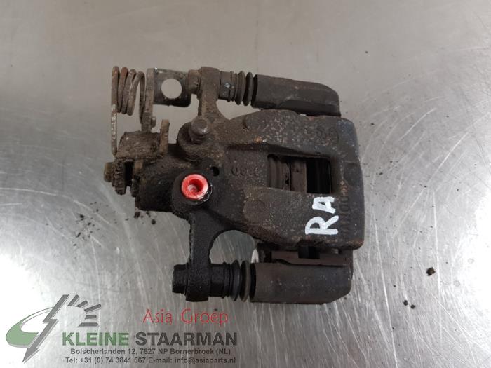 Rear brake calliper, right from a Kia Rio III (UB) 1.2 CVVT 16V 2016