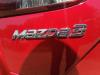 Mangueta izquierda detrás de un Mazda 3 (BM/BN), 2013 / 2019 2.0 SkyActiv-G 120 16V, Hatchback, Gasolina, 1.997cc, 88kW (120pk), FWD, PEY7; PEY5; PEXL, 2013-09 / 2019-05 2015