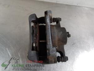 Used Front brake calliper, right Nissan Qashqai (J11) 1.2 12V DIG-T Price on request offered by Kleine Staarman B.V. Autodemontage