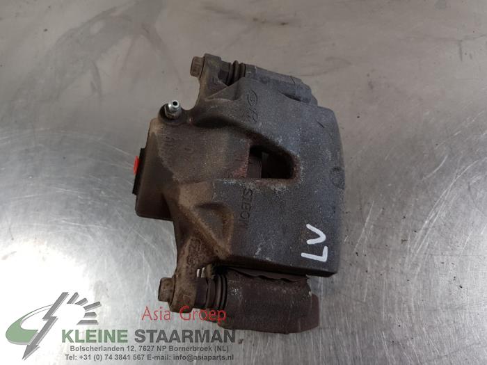 Front brake calliper, left from a Kia Sportage (QL) 1.6 T-GDI 177 16V 4x4 2016