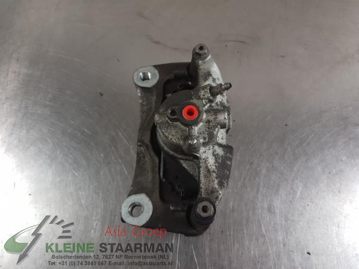 Front brake calliper, left from a Mazda 3 (BP) 2.0 SkyActiv-X 180 M Hybrid 16V 2019