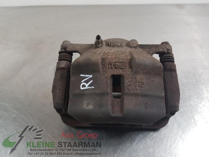 Pinza de freno derecha delante de un Nissan X-Trail (T31) 2.0 16V XE,SE,LE 4x4 2008