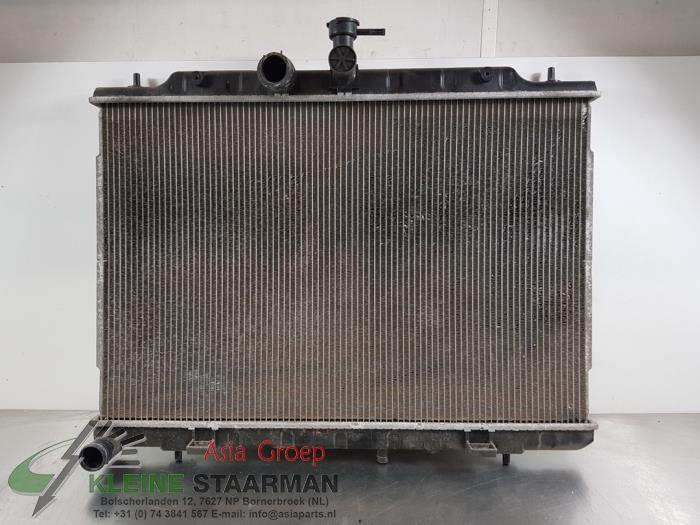 Radiator from a Nissan X-Trail (T31) 2.0 XE,SE,LE dCi 16V 4x4 2012