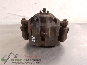 Used Front brake calliper, left Kia Carens III (FG) 2.0i CVVT 16V Price on request offered by Kleine Staarman B.V. Autodemontage