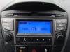 Radio CD Spieler van een Hyundai iX35 (LM), 2010 / 2015 1.6 GDI 16V, SUV, Benzin, 1.591cc, 99kW (135pk), FWD, G4FD; EURO4, 2010-11 / 2015-09, F5P21; F5P31 2014
