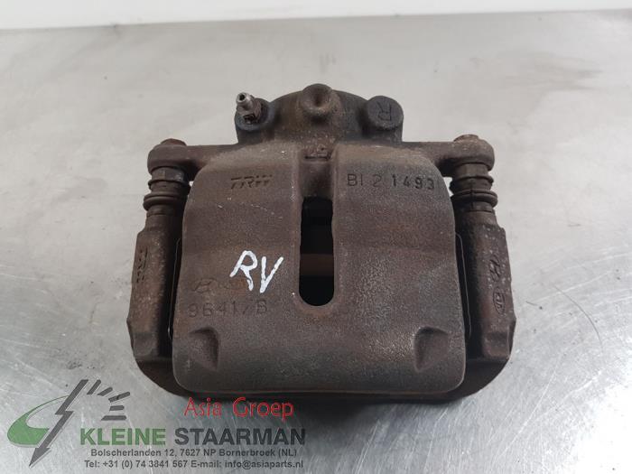 Front brake calliper, right from a Kia Venga 1.4 CVVT 16V 2014