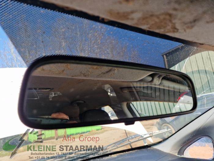 Rear view mirror from a Kia Rio III (UB) 1.2 CVVT 16V 2013