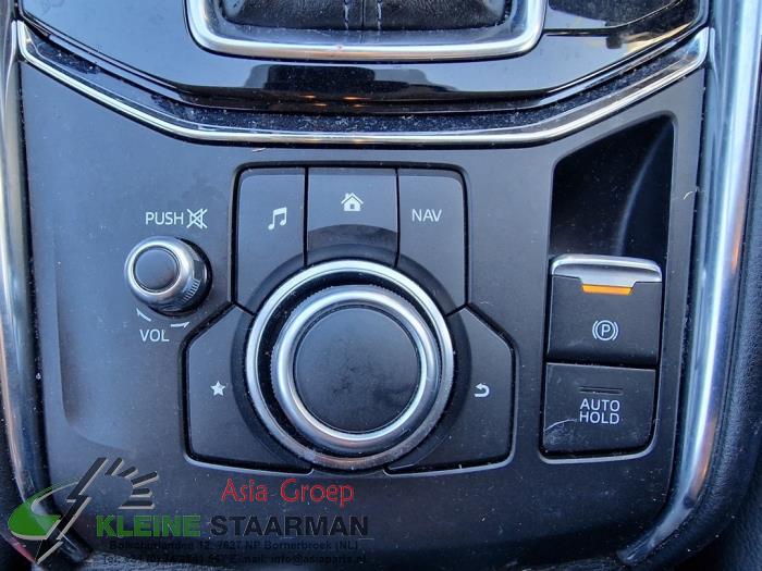 Parking brake switch from a Mazda CX-5 (KF) 2.2 SkyActiv-D 150 16V 2WD 2018