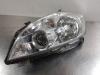 Headlight, left from a Toyota Auris (E15) 1.8 16V HSD Full Hybrid 2012