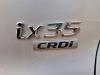 Amortisseur arrière gauche d'un Hyundai iX35 (LM), 2010 / 2015 1.7 CRDi 16V, SUV, Diesel, 1.685cc, 85kW (116pk), FWD, D4FD, 2010-11 / 2015-09, F5D31; F5D41 2013