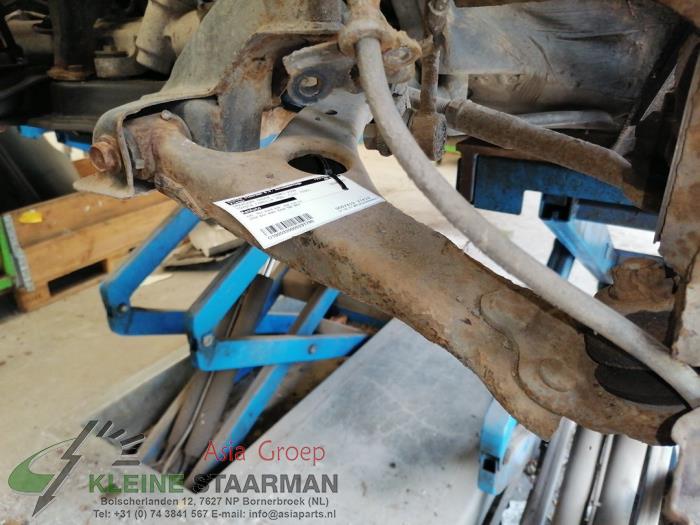 Front lower wishbone, left from a Toyota Corolla Verso (R10/11) 1.8 16V VVT-i 2006