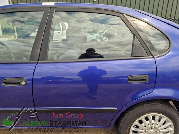Rear door 4-door, left from a Toyota Corolla (EB/ZZ/WZ/CD) 1.4 16V VVT-i 2000