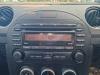 Radio/Lecteur CD d'un Mazda MX-5 (NC18/1A), 2006 / 2014 1.8i 16V, Cabriolet , Essence, 1.798cc, 93kW (126pk), RWD, L828; L8DE, 2005-03 / 2014-12, NC188; NCA88; NC1A 2010