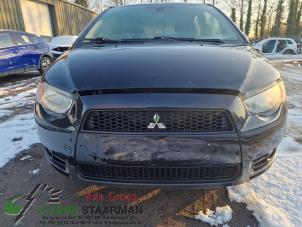 Used Front bumper Mitsubishi Colt (Z2/Z3) 1.3 16V Price on request offered by Kleine Staarman B.V. Autodemontage