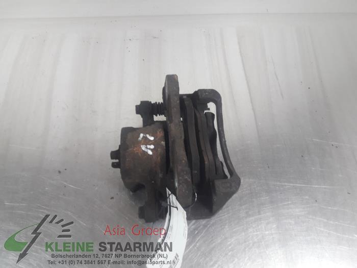 Front brake calliper, left from a Daewoo Lacetti (KLAN) 1.4 16V 2006