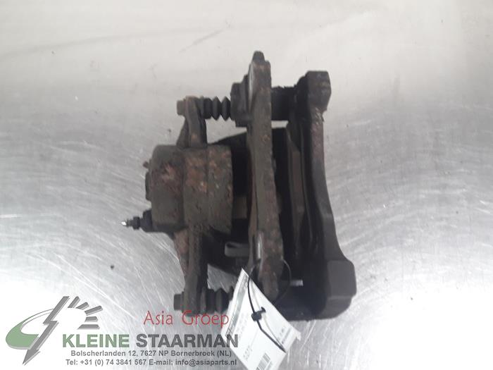 Front brake calliper, left from a Toyota Corolla Verso (R10/11) 1.8 16V VVT-i 2004