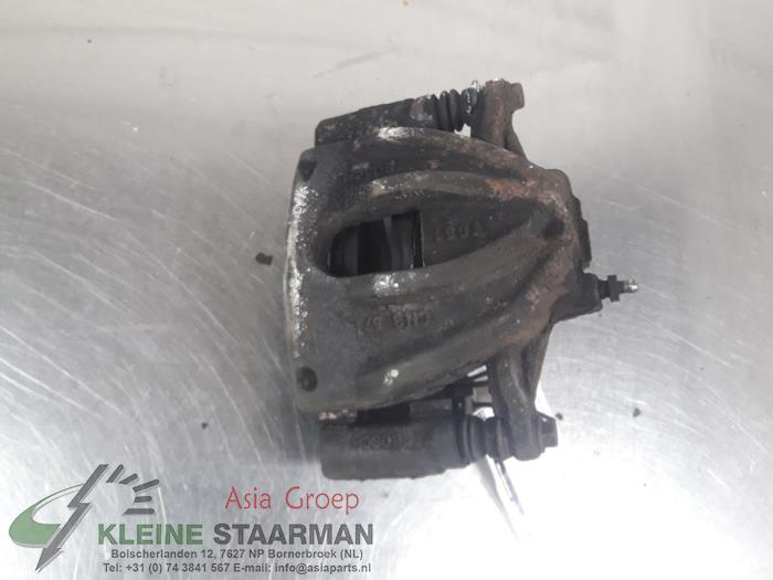 Front brake calliper, left from a Toyota Corolla Verso (R10/11) 1.8 16V VVT-i 2004