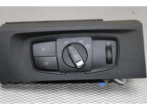 Usados Interruptor de luz BMW 1 serie (F20) 120d TwinPower Turbo 2.0 16V Precio € 30,00 Norma de margen ofrecido por Gebr Opdam B.V.