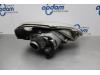Headlight, left from a Renault Trafic New (FL) 1.9 dCi 100 16V 2003