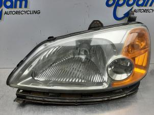 Używane Reflektor lewy Honda Civic (EM) 1.7 16V LS Cena € 90,00 Procedura marży oferowane przez Gebr Opdam B.V.
