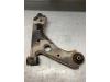 Front lower wishbone, left from a Opel Corsa D 1.2 16V 2011