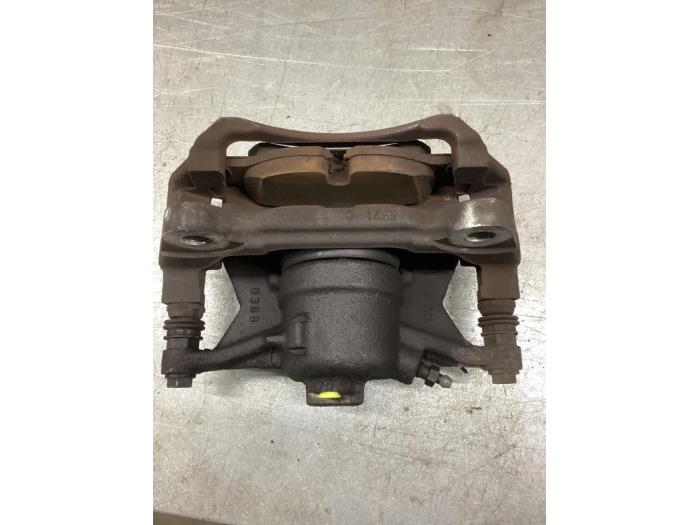 Front brake calliper, left from a Volkswagen Caddy IV 2.0 TDI 102 2018