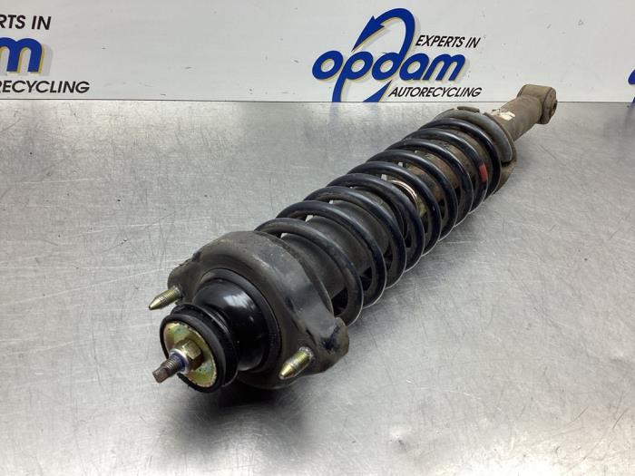 Rear shock absorber rod, left from a Mitsubishi Space Star (DG) 1.3 16V 2002