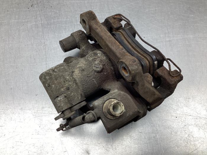 Rear brake calliper, left from a Toyota Yaris II (P9) 1.0 12V VVT-i 2006