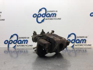 Used Rear brake calliper, left Nissan Almera (N16) 1.8 16V Price € 60,00 Margin scheme offered by Gebr Opdam B.V.