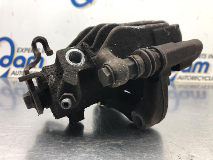 Rear brake calliper, left from a Volkswagen Polo V (6R) 1.0 TSI 12V BlueMotion 2017