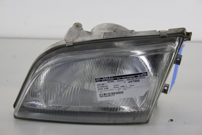 Headlight, left from a Mitsubishi Space Star (DG) 1.3 16V 1999
