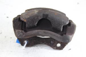 Used Front brake calliper, left Nissan Almera (N16) 1.5 16V Price € 40,00 Margin scheme offered by Gebr Opdam B.V.