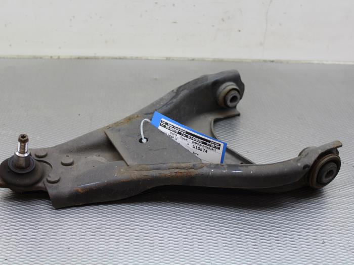 Front lower wishbone, left from a Dacia Duster (HS) 1.5 dCi 2010